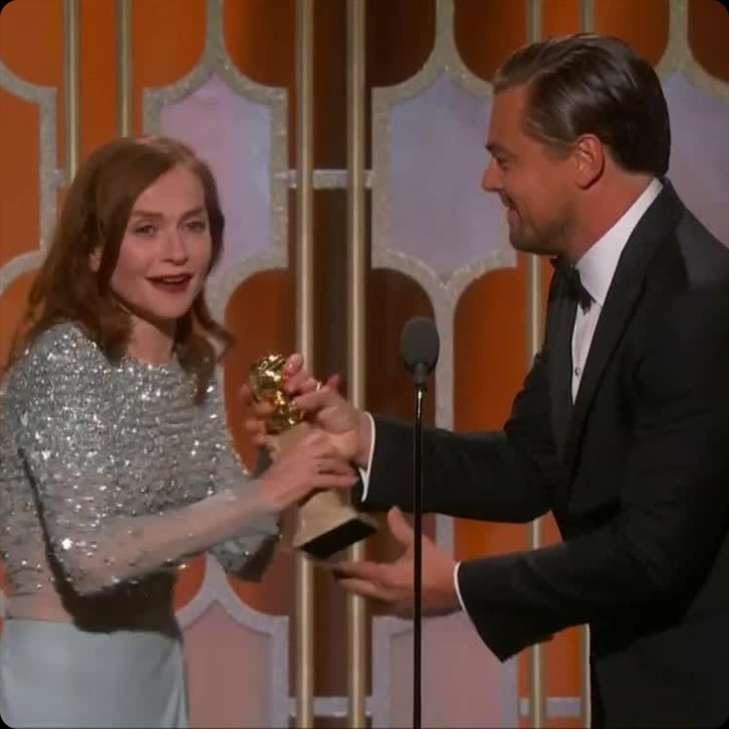 Isabelle Huppert receives Golden Globe from Leonardo DiCaprio